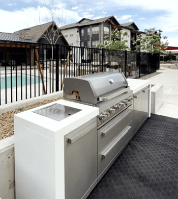 Outdoor dining area with gas grilling stations